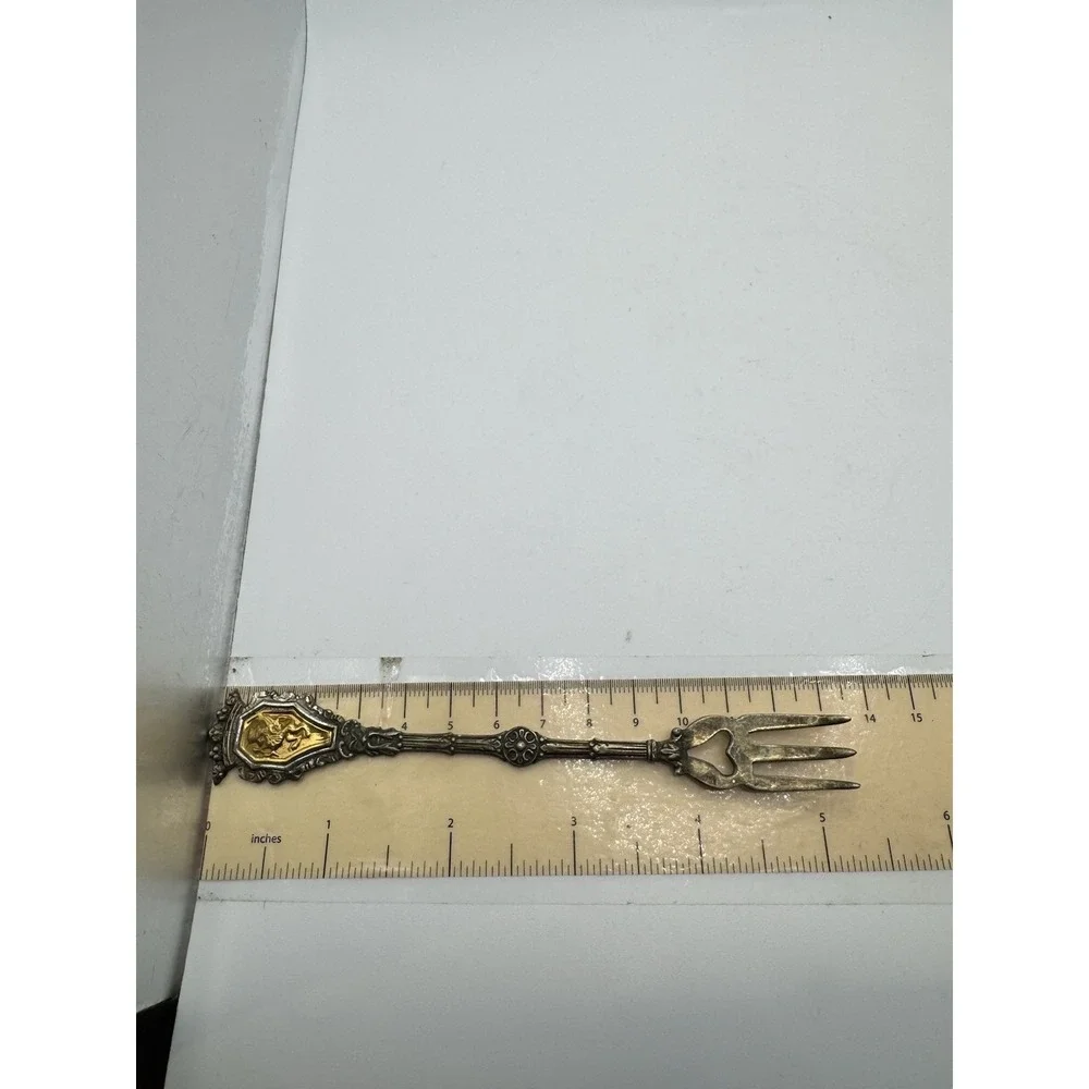Ornate Italian souvenir fork with a lion rampant and crown motif